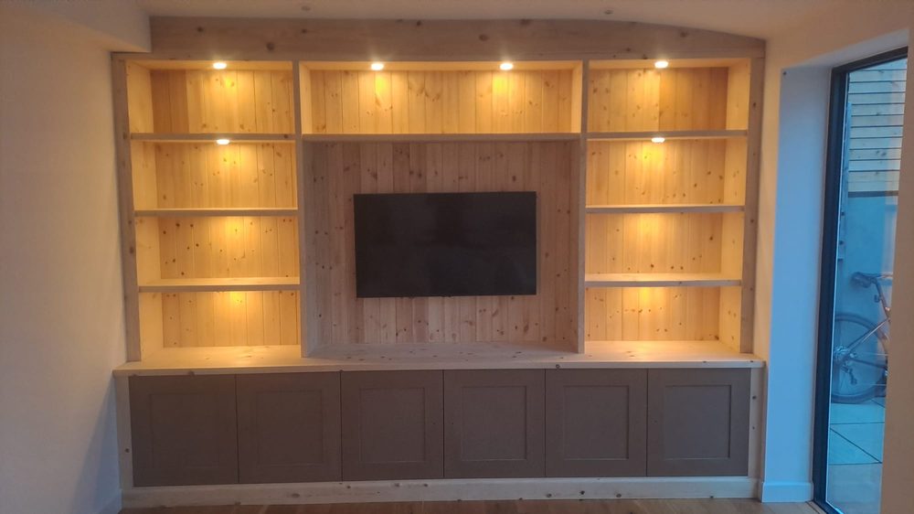 Alcove shelving unit with integrated LED downlights, open to show depth